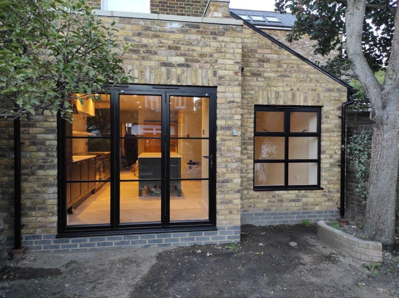 Explore our stunning double storey kitchen and dining extension project in Wandsworth, London. From structural alterations to a bespoke kitchen installation and high-quality interior finishes, we transform your living space and maximise natural light.